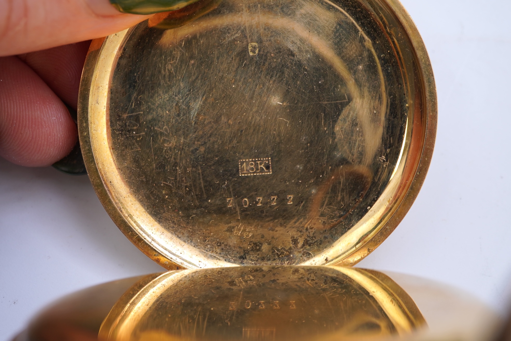 A continental 18k gold open faced keyless lever pocket watch, with a 9ct albert